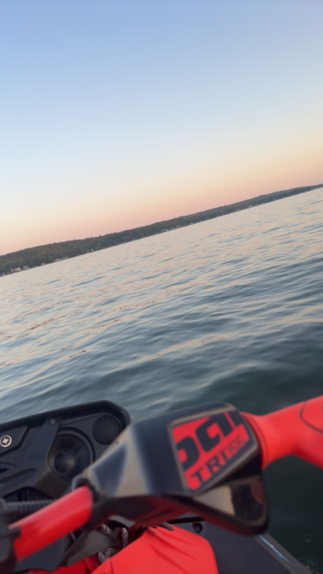 View over jet ski handlebars at dusk